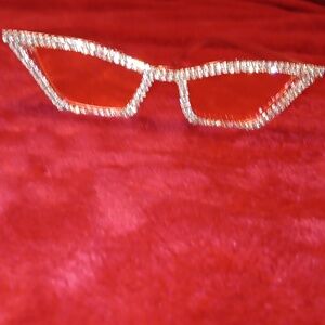 DIAMOND SUNGLASSES. Pink plastic frame sunglasses with bling.
